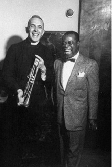 Fr Trevor Huddleston receiving  a trumpet from Louis Armstrong, for Hugh Masekela, on 1 May 1956, in the USA. Photo by Wallace Kirkland